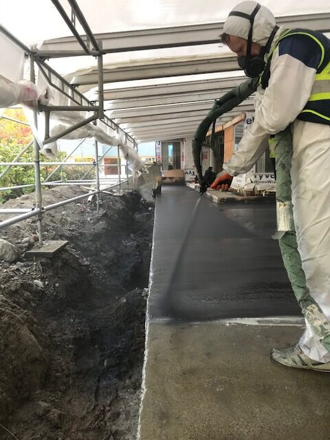 Spray-applied polyurea membrane being installed by West Coast Waterproofing