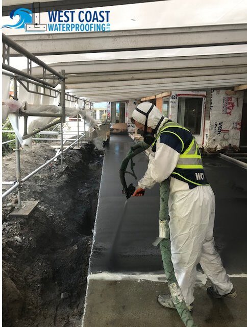 Spray-applied polyurea membrane being installed by West Coast Waterproofing