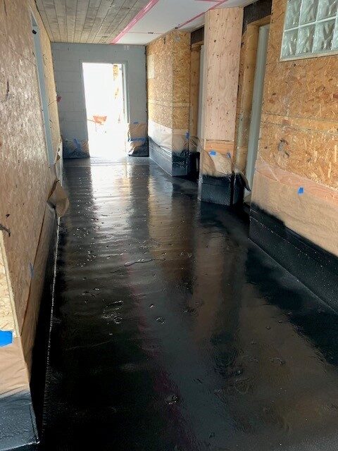 Spray-applied polyurea membrane being installed by West Coast Waterproofing