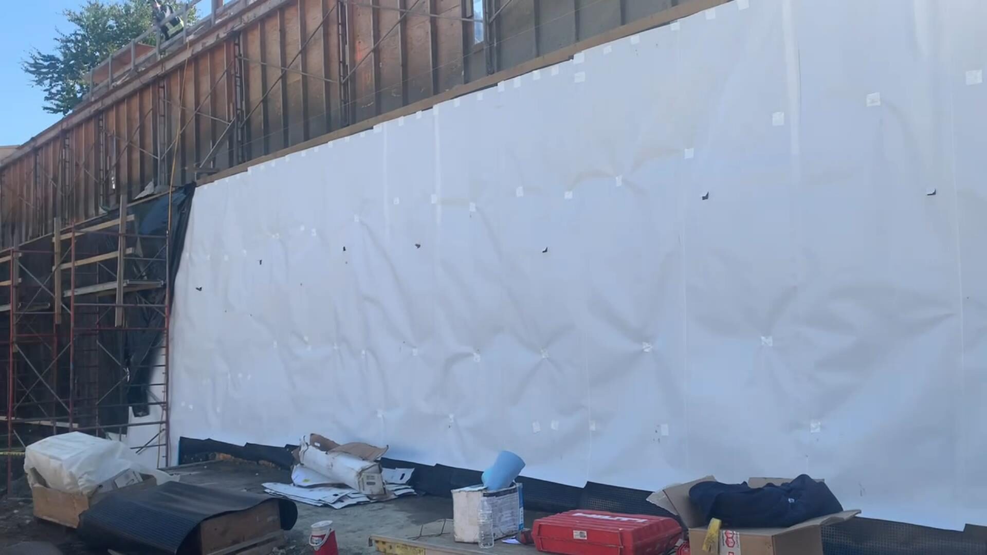 Blindside pre-applied waterproofing membrane installed against shoring by West Coast Waterproofing