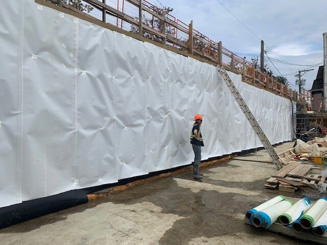 Blindside pre-applied waterproofing membrane installed against shoring by West Coast Waterproofing