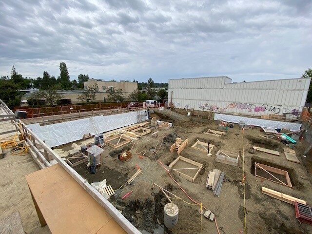 Blindside pre-applied waterproofing membrane installed against shoring by West Coast Waterproofing