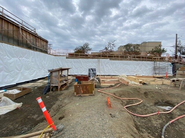 Blindside pre-applied waterproofing membrane installed against shoring by West Coast Waterproofing